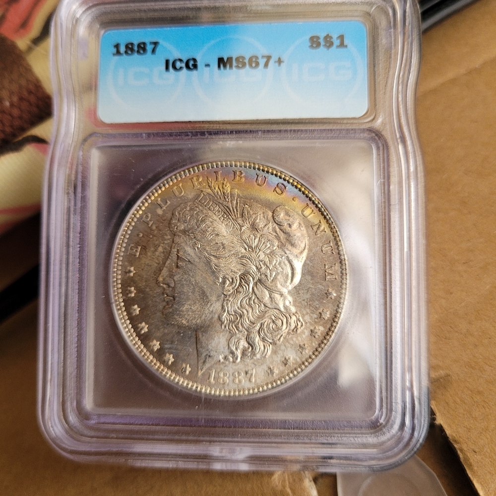 1887 Morgan silver dollar coin MS67+